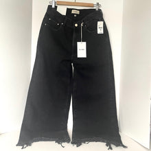 Load image into Gallery viewer, Black jeans with tags on a white background