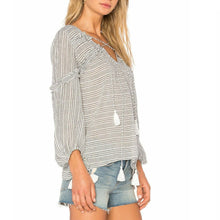 Load image into Gallery viewer, Woman wearing a striped blouse with tassel details on a white background