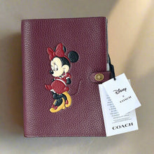 Load image into Gallery viewer, Coach x Disney collaboration leather product with Minnie Mouse design and Coach tag.
