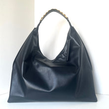 Load image into Gallery viewer, Black leather handbag on a white background