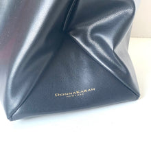 Load image into Gallery viewer, Blue leather clutch bag with 'Donna Karan' branding on a white background