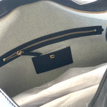 Load image into Gallery viewer, Close-up of a gray suitcase with a blue zipper and a visible brand logo.