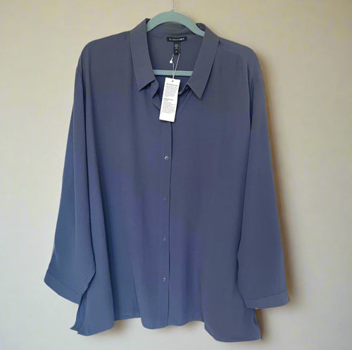 Blue shirt on a hanger against a white background