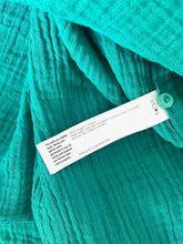 Load image into Gallery viewer, Teal sweater with a label on a white background