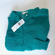 Load image into Gallery viewer, Folded teal baby outfit with a tag on a white background
