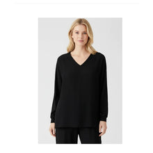 Load image into Gallery viewer, Woman wearing a black long-sleeve top on a white background