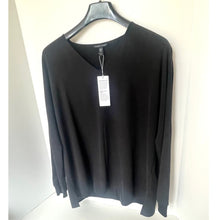 Load image into Gallery viewer, Black sweater on a hanger with a tag, against a white background