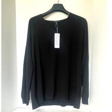 Load image into Gallery viewer, Black sweater on a hanger with a tag against a white background