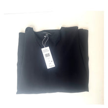 Load image into Gallery viewer, Folded dark gray shirt with a tag on a light beige background