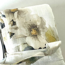 Load image into Gallery viewer, Floral-patterned fabric with a zipper on a light background