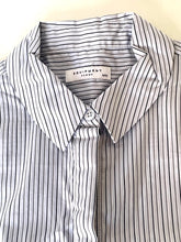 Load image into Gallery viewer, Close-up of a striped shirt with 'Equipment' label on a white background