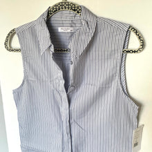 Load image into Gallery viewer, Striped shirt vest on a hanger with visible brand label