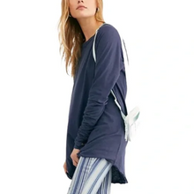 Load image into Gallery viewer, Woman wearing a navy blue long-sleeve top with a white strap over her shoulder on a white background