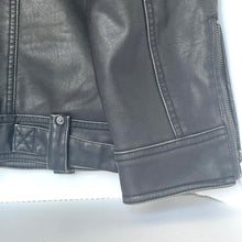 Load image into Gallery viewer, Close-up of a black leather jacket on a white background