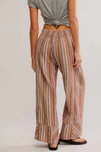 Load image into Gallery viewer, Person wearing striped pants and a tied gray top on a plain background
