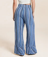Load image into Gallery viewer, Blue striped wide-leg pants worn by a person on a beige background