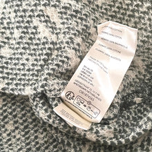 Load image into Gallery viewer, Textile label on a textured fabric background