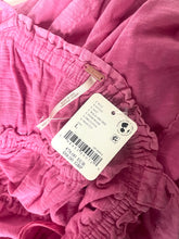 Load image into Gallery viewer, Close-up of pink fabric with a tag attached