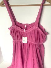 Load image into Gallery viewer, Pink dress with ruffled straps on a hanger against a white background
