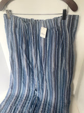 Load image into Gallery viewer, Blue and white striped pants on a hanger with a visible tag.