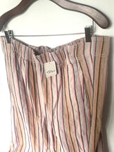 Load image into Gallery viewer, Striped pants on a hanger with a tag, against a white background