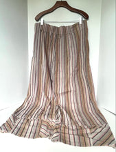 Load image into Gallery viewer, Striped skirt on a hanger against a white background