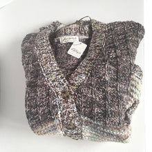 Load image into Gallery viewer, Knitted bag with a visible brand label on a white background