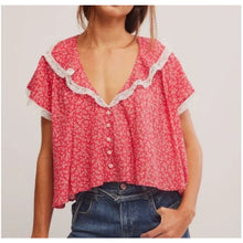 Load image into Gallery viewer, Red floral blouse with white lace trim worn by a person on a plain background