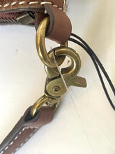 Load image into Gallery viewer, Close-up detail of a brown leather strap with white stitching, a brass ring, and a large antique brass lobster clasp on a white background.