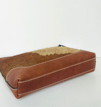 Load image into Gallery viewer, A rectangular leather and hide bag with brown leather sides and a tan and brown hide top panel, featuring white contrast stitching, photographed on a plain white background.
