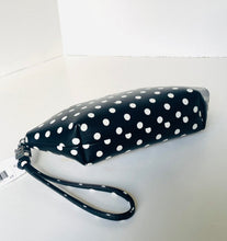 Load image into Gallery viewer, Black clutch with white polka dots on a white background