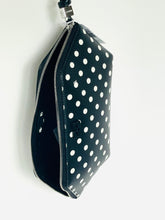 Load image into Gallery viewer, Black pouch with white polka dots on a white background