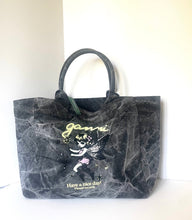Load image into Gallery viewer, A dark gray marbled canvas tote bag with black handles, featuring a graphic of a fairy and the text 'Jenni' and 'Have a nice day! Please excuse' on the front, set against a plain off-white background.