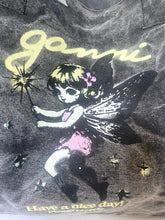 Load image into Gallery viewer, A close-up of a dark gray or black t-shirt featuring a graphic print of a fairy girl with wings and the text 'janni' and 'Have a nice day!'.