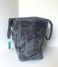 Load image into Gallery viewer, A dark gray marbled canvas tote bag with black handles, photographed against a plain white background.