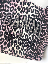 Load image into Gallery viewer, Pink leopard print bag with black text on a white background