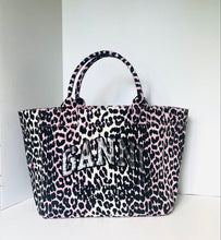 Load image into Gallery viewer, Leopard print handbag with 'Ganni' branding on a white background