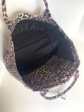 Load image into Gallery viewer, Leopard print bag with a black interior on a white background