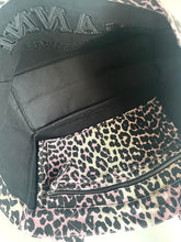 Load image into Gallery viewer, Leopard print fabric inside a black bag