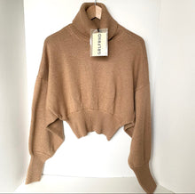 Load image into Gallery viewer, Brown sweater on a hanger with a visible brand tag against a white background