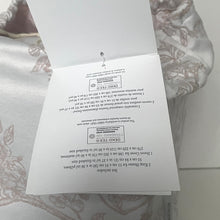 Load image into Gallery viewer, Product packaging with text and EXO-TFC logo on a patterned fabric background