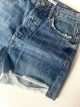 Load image into Gallery viewer, Blue denim shorts with frayed hem on a white background