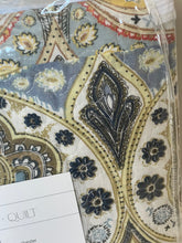 Load image into Gallery viewer, Close-up of a patterned fabric with intricate designs.