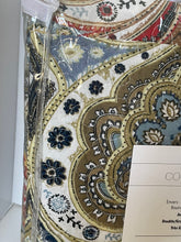 Load image into Gallery viewer, Decorative fabric with paisley pattern and a clear plastic bag on a textured surface.