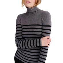 Load image into Gallery viewer, Person wearing a gray turtleneck sweater with black horizontal stripes on a light gray background