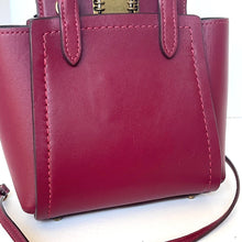 Load image into Gallery viewer, Pink handbag with a strap on a white background