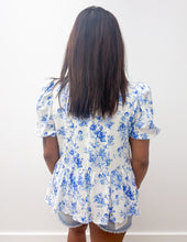 Load image into Gallery viewer, Blue patterned shirt on a hanger against a white background