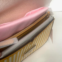 Load image into Gallery viewer, Close-up of a striped box with a pink cushion inside