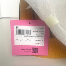 Load image into Gallery viewer, Pink tag with product details on a sunglasses packaging