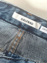 Load image into Gallery viewer, Close-up of a denim fabric with a 'GRLFRND' label.